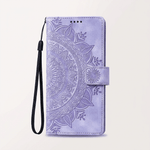 Apple iPhone wallet case in lavender leather with an embossed floral mandala pattern, magnetic strap and black wrist loop