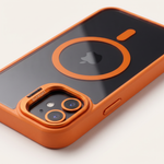 Apple iPhone case in black and orange with a glossy back, circular magnetic ring, and raised camera lens guard