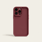 Apple iPhone silicone case in deep burgundy with a smooth matte finish, raised camera surround and reinforced edges