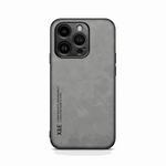Apple iPhone case in charcoal gray with a textured leather-look finish, raised camera edges and slim black trim