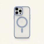 Apple iPhone case with a clear rigid back, pale blue edges, and a matching MagSafe ring and alignment bar