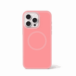 Apple iPhone case in coral pink with a smooth, translucent finish, raised camera surround and MagSafe ring