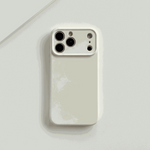 Apple iPhone case in pale cream with a smooth silicone finish and raised camera edge around multiple rear lenses
