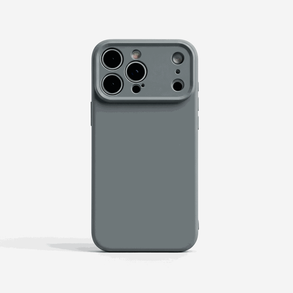 Apple iPhone silicone case in muted gray with a smooth finish and raised camera edge around multiple lens cutouts