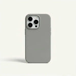 Apple iPhone case in matte gray silicone with a smooth solid-color finish and raised camera opening for three lenses