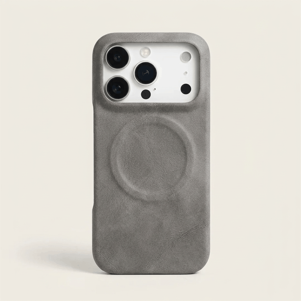 Apple iPhone case in textured grey leather with a raised circular MagSafe ring and protective camera cutout
