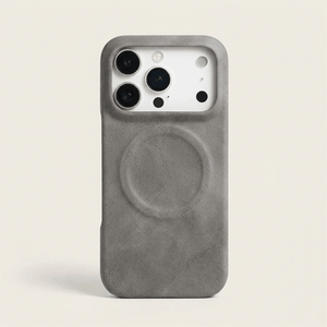 Apple iPhone case in textured grey leather with a raised circular MagSafe ring and protective camera cutout