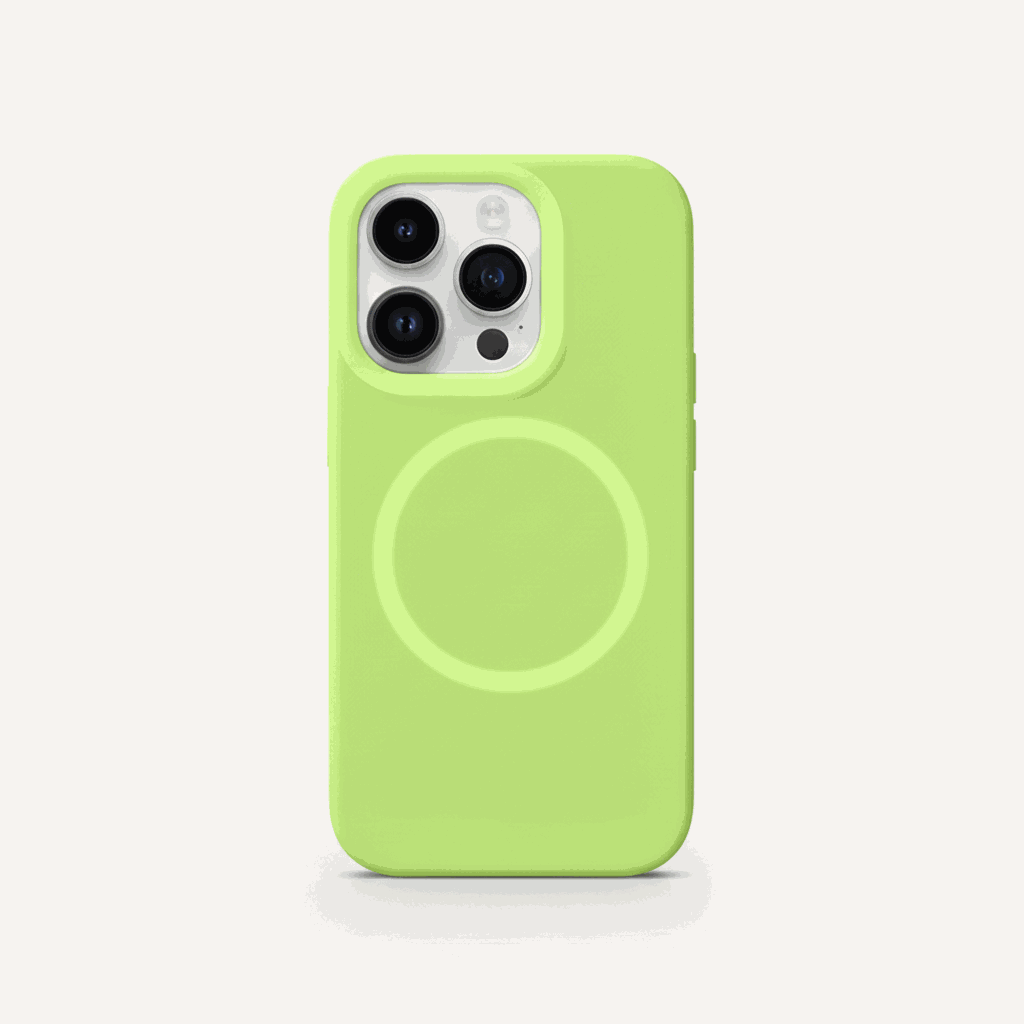 Apple iPhone case in bright lime green with a smooth soft-touch finish, raised camera rim and MagSafe ring