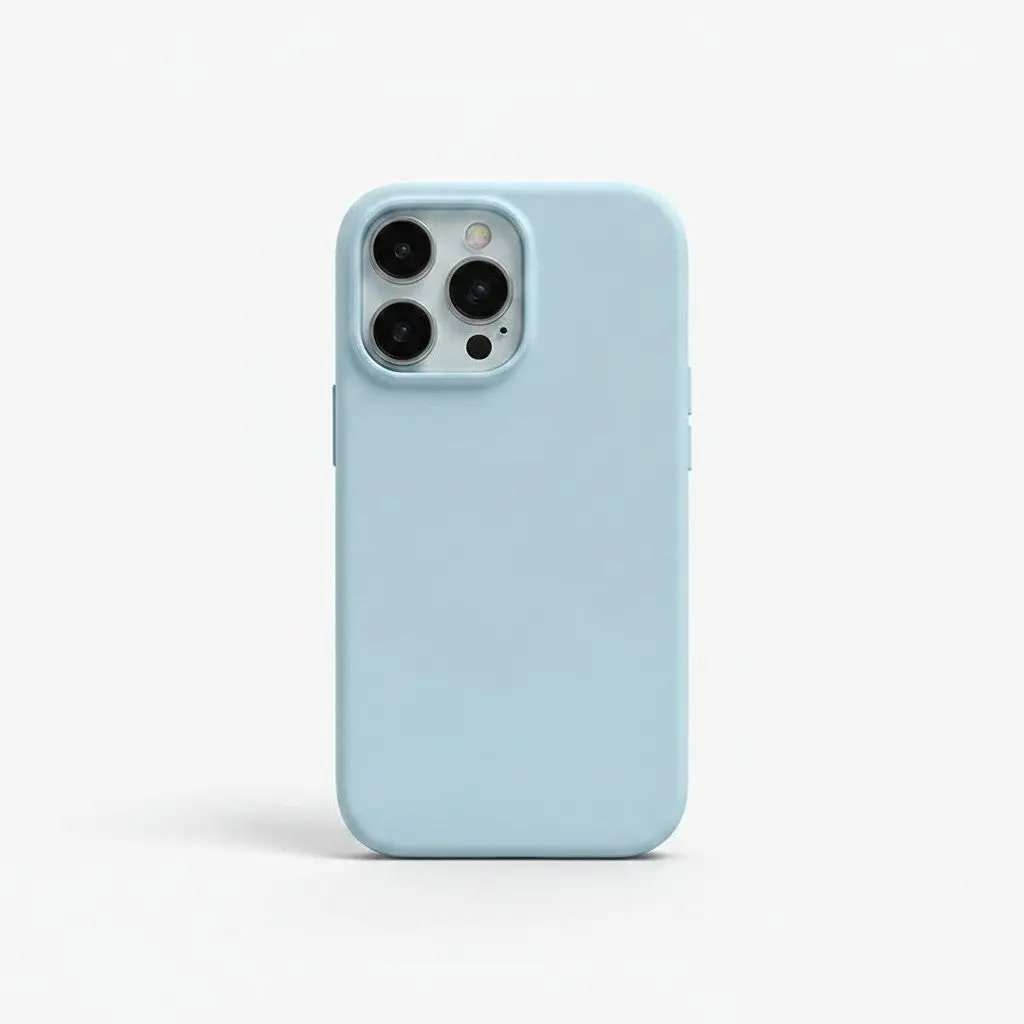 Apple iPhone case in pale blue liquid silicone with a smooth solid-color finish and raised camera edges