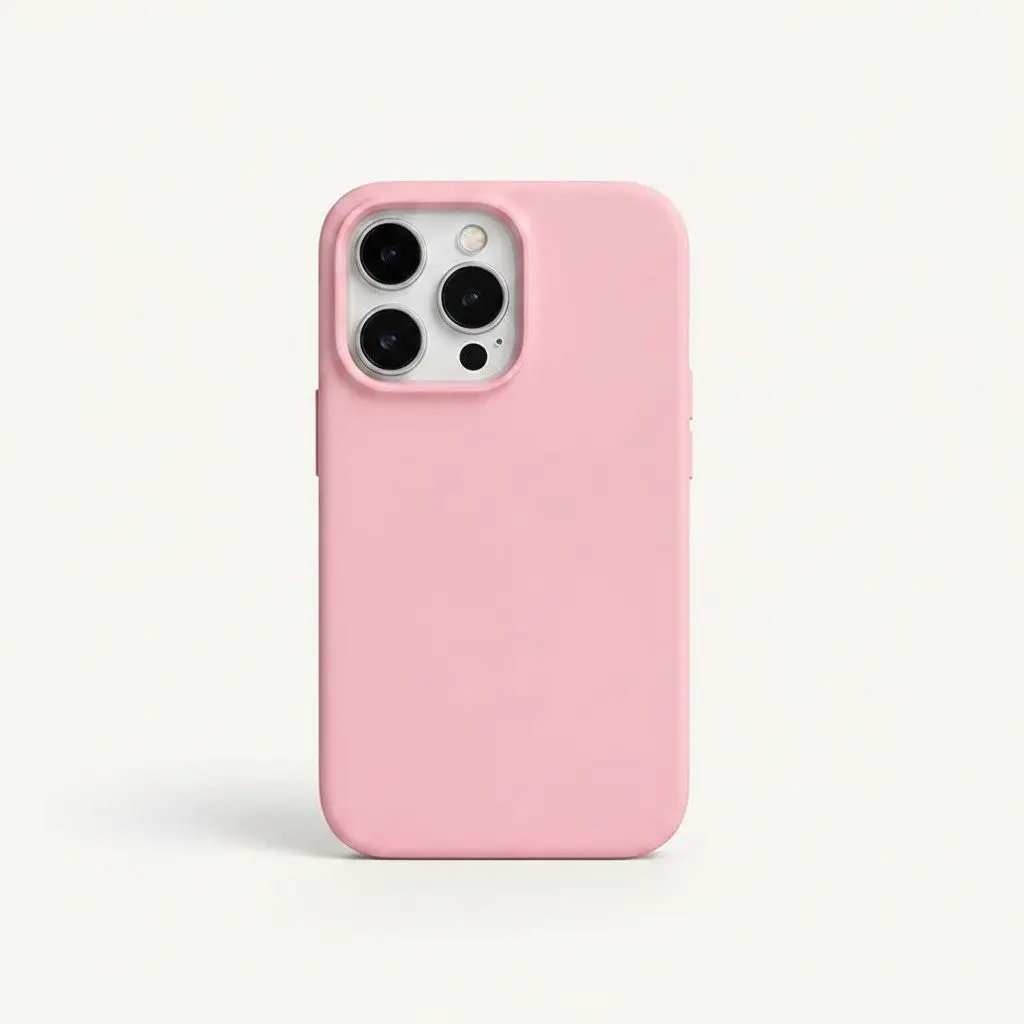 Apple iPhone case in soft pink silicone with a smooth matte finish and raised camera-lens protection