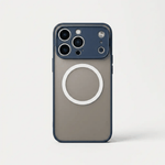 Apple iPhone hard case in smoky gray with a matte back, dark blue edges, raised camera surround and white MagSafe ring