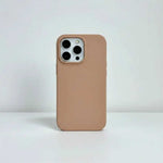 Apple iPhone case in smooth tan silicone with a slim profile and raised camera cutout around three lenses