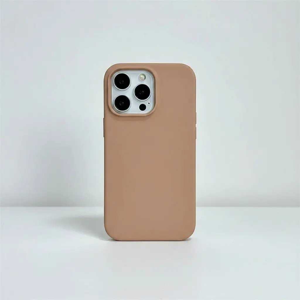 Apple iPhone case in smooth tan silicone with a slim profile and raised camera cutout around three lenses