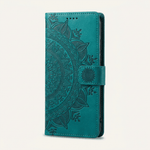 Apple iPhone wallet case in teal embossed leather with an ornate mandala pattern and magnetic side strap