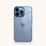 Apple iPhone in a transparent blue-tinted case with a slim profile, raised edges and precise triple-camera cutout