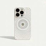 Apple iPhone case in white with a textured finish, radiating ventilation slots, and a central circular MagSafe pattern