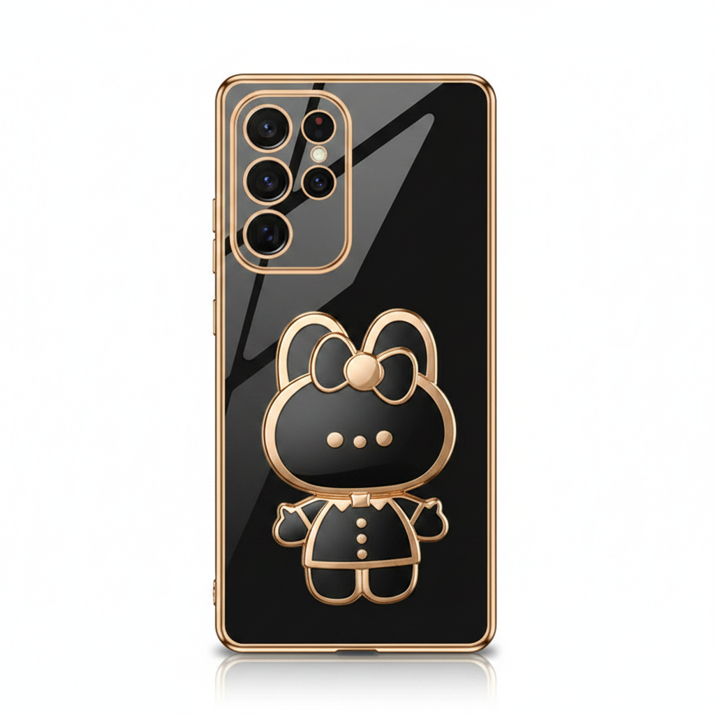 Samsung Galaxy phone case with a glossy black mirror finish, gold trim, and a raised bear character stand
