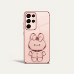 Samsung Galaxy phone case in blush pink with a glossy finish and raised bear character with bow detail