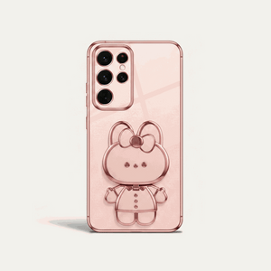 Samsung Galaxy phone case in blush pink with a glossy finish and raised bear character with bow detail