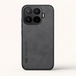 Xiaomi Magnetic Leather Look phone case in dark gray with fine leather-like texture, raised camera rim and bumper edges
