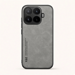 Phone case, Xiaomi Magnetic Leather Look in dark gray with a textured leather-style finish, raised camera surround and bumper edges
