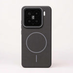 Xiaomi Magnetic Phone Case in charcoal matte finish, with a raised camera rim and circular magnetic ring alignment mark.