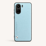Xiaomi Sleek Leather Look Case in light blue with a fine textured finish, black edging, dual camera cutout and metallic accent